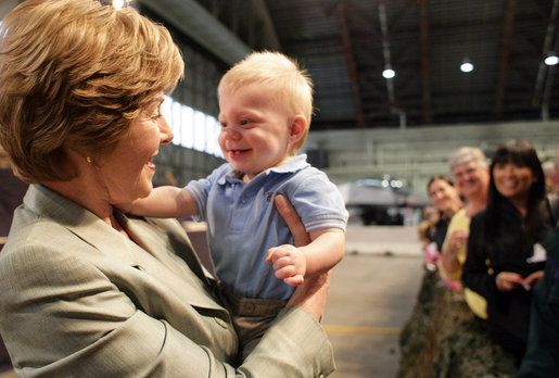 Mrs. Laura Bush receives a smile from a young boy as she greets the audience Monday, Aug. 4, 2008, after remarks by the President at Eielson Air Force Base, Alaska, their first stop en route to Asia. White House photo by Shealah Craighead
