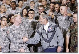 President George W. Bush shakes hands with one of the many personnel he met following his remarks at the U.S. Army Garrison-Yongsan Wednesday, August 6, 2008, in Seoul, South Korea. White House photo by Eric Draper