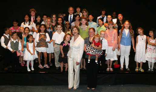 President George W. Bush, top center, and Mrs. Laura Bush stop to pose with a group of elementary school children at the Blue House in Seoul on Aug. 6, 2008. White House photo by Shealah Craighead