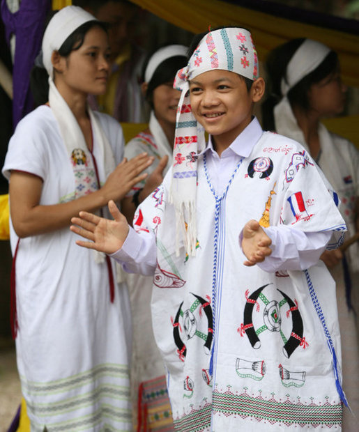Residents of the Mae La Refugee Camp at Mae Sot, Thailand, perform traditional dance for Mrs. Laura Bush during her visit to the camp on the Burma border on Aug. 7, 2008. It has been almost 20 years since the August 8, 1988 crackdown in Burma which began forcing residents from the country. Many of the people in the Mae La Refugee Camp and the other eight camps along the border have been born in the camps or lived most of their lives in the camps, waiting for conditions to improve in Burma or to move to the United States and other countries. White House photo by Shealah Craighead