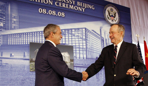 President George W. Bush is welcomed to the podium after an introduction by former President George H.W. Bush Friday, Aug. 8, 2008, at the dedication for the U.S. Embassy in Beijing. White House photo by Eric Draper