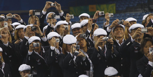 United States Olympians take photos of President George W. Bush as he speaks to the athletes Friday, Aug. 8, 2008, prior to the start of the Opening Ceremony for the 2008 Summer Olympic Games in Beijing. White House photo by Eric Draper