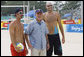 President George W. Bush pauses with U.S. Men's Beach Volleyball's Todd Rogers, left, and Philip Dalhausser as he visited the practice session Saturday, Aug. 9, 2008, at Beijing's Chaoyang Park prior to their first matches of the 2008 Summer Olympic Games. White House photo by Eric Draper