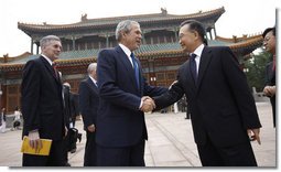President George W. Bush is greeted by Chinese Premier Wen Jiabao Sunday, Aug. 10, 2008, at Zhongnanhai, the Chinese leaders compound in Beijing.  White House photo by Eric Draper