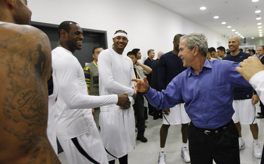 President George W. Bush shares a moment with U.S. Olympic Men's Basketball Team member LeBron James and other members of the team Sunday, Aug. 10, 2008, during a visit with the team prior to their game against China at the 2008 Summer Olympic Games in Beijing. White House photo by Eric Draper