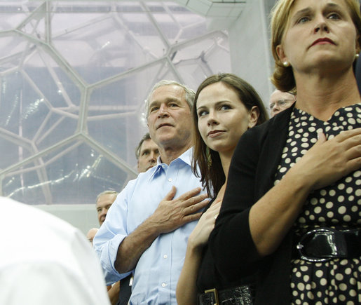 President George W. Bush, daughter Barbara Bush and Mrs. Doro Koch, the President's sister, stand for the playing of the U.S. national anthem Sunday, Aug. 10, 2008, during the medal ceremony honoring gold-medalist Michael Phelps. The U.S. Olympian won his first event, the 400-meter Individual Medley, in a record time of 4:3.84. White House photo by Eric Draper