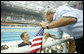 President George W. Bush shakes hands with U.S. swimmer Larsen Jensen after the 22-year-old won his bronze medal in the 400-meter freestyle Sunday, Aug. 10, 2008, at the 2008 Summer Olympics. White House photo by Eric Draper