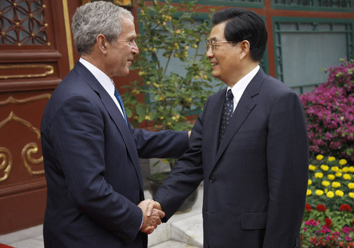 President George W. Bush shakes hands with China's President Hu Jintao following his visit and meeting Sunday, Aug. 10, 2008, with the Chinese leader at Zhongnanhai, the Chinese leaders compound in Beijing. White House photo by Eric Draper