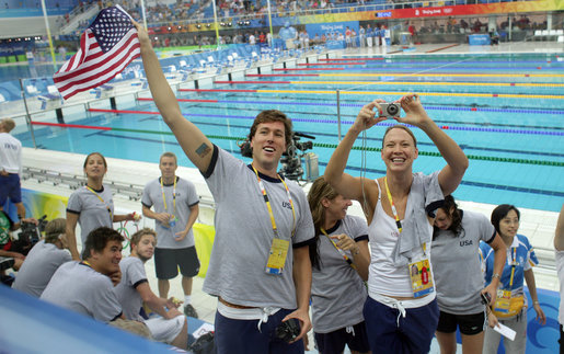 U.S. athletes wave to President George W. Bush and Mrs. Laura Bush after their arrival Sunday, Aug. 10, 2008, to the National Aquatics Center in Beijing, where they viewed the morning session of the swimming competition at the 2008 Summer Olympics. White House photo by Shealah Craighead