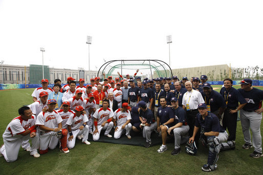 President George W. Bush poses for photos with members of the U.S. and China's men's Olympic baseball teams prior to a practice game between the two teams Monday, Aug. 11, 2008, at the 2008 Summer Olympic Games in Beijing. White House photo by Eric Draper