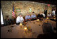 President George W. Bush is joined by Mississippi Governor Haley Barbour, second from left, and Gulfport, Miss., Mayor Brent Warr, right, Wednesday, Aug. 20, 2008 during a dinner with community leaders in Gulfport. Miss., to discuss the continued recovery efforts three years after Hurricane Katrina. White House photo by Eric Draper