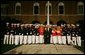 President and Mrs. Bush pose for a photograph with participants of the Evening Parade at the Marine Barracks Friday, August 29, 2008, in Washington DC. White House photo by Joyce N. Boghosian