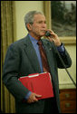 President George W. Bush calls Texas Governor Rick Perry, Saturday, Aug. 30, 2008, to discuss the impending storms that are expected to strike Texas and areas of the Gulf Coast region as a result of Hurricane Gustav. White House photo by Chris Greenberg