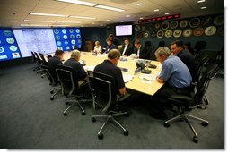 President George W. Bush, joined by Federal Emergency Management Agency Administrator David Paulison, right, and Deputy Administrator Harvey Johnson, left, participates in a briefing on preparations for Hurricane Gustav, at the FEMA National Response Center, Sunday, August 31, 2008 in Washington, DC. White House photo by Chris Greenberg