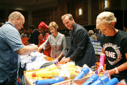 Mrs. Laura Bush, joined by Mrs. Cindy McCain, right, help HIV and AIDS advocate Princess Kasune Zulu, left, and One Chairman and CEO David Lane assemble care-giver packages at the ONE campaign event Tuesday, Sept. 2, 2008 at the Minneapolis Convention Center in Minneapolis, in support of health care workers who treat AIDS paitients in African countries. White House photo by Shealah Craighead