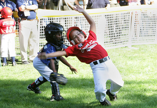 The Stars catcher reaches to tag out a Stripes player during home plate action at the Tee Ball on the South Lawn: A Salute to the Troops game Sunday, Sept. 7, 2008 at the White House, played by the children of active-duty military personnel. White House photo by Chris Greenberg