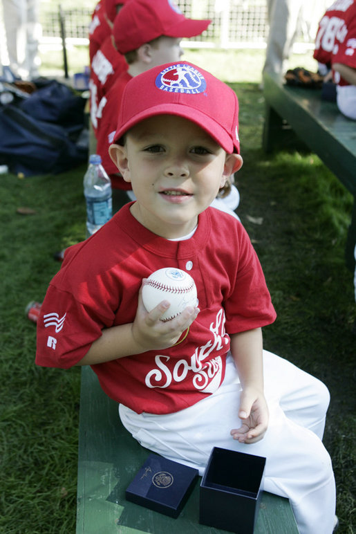 Nathan Chando of Hudsonville, Mich. holds up a baseball he received from President George W. Bush following the Tee Ball on the South Lawn: A Salute to the Troops game Sunday, Sept. 7, 2008, on the South Lawn at the White House. White House photo by Grant Miller