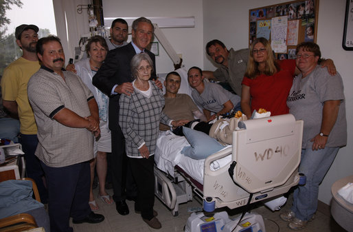 President George W. Bush stands with the extended family of U.S. Army Sgt. Jason Shepperly of Birmingham, Ala., during a visit Tuesday, Sept. 9, 2008, to Walter Reed Army Medical Center, where the soldier is recovering from wounds received during Operation Iraqi Freedom. White House photo by Eric Draper
