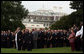 President George W. Bush and Mrs. Laura Bush stand with Vice President Dick Cheney and Mrs. Lynne Cheney and staff, family and friends Thursday, Sept. 11, 2008, in a South Lawn observance of the seventh anniversary of the September 11 terrorist attacks. White House photo by David Bohrer