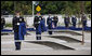 Soldiers hold ceremonial cloths that were draped over the 184 memorial benches, each honoring all innocent life lost when American Airlines Flight 77 crashed into the Pentagon on Sept. 11, 2001, during the dedication of the 9/11 Pentagon Memorial Thursday, Sept. 11, 2008, in Arlington, Va. White House photo by Eric Draper