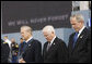 President George W. Bush is joined by former Secretary of Defense Donald Rumsfeld, left, and U.S. Secretary of Defense Robert Gates, as they bow their heads during a moment of silence Thursday, Sept. 11, 2008, during the dedication of the 9/11 Pentagon Memorial at the Pentagon in Arlington, Va. White House photo by Eric Draper
