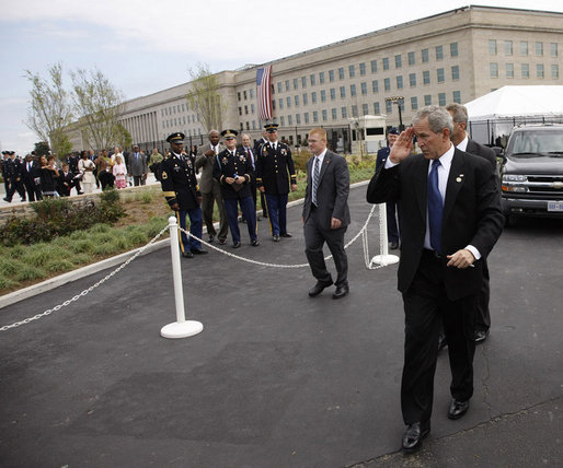President George W. Bush salutes to military personnel as he arrives at the Pentagon Thursday, Sept. 11, 2008, for the dedication of the 9/11 Pentagon Memorial at the Pentagon in Arlington, Va. White House photo by Eric Draper