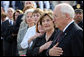 Mrs. Laura Bush stands with Vice President Dick Cheney during the National Anthem Thursday, Sept. 11, 2008, at the dedication ceremony for the 9/11 Pentagon Memorial at the Pentagon in Arlington, Va. White House photo by Joyce N. Boghosian