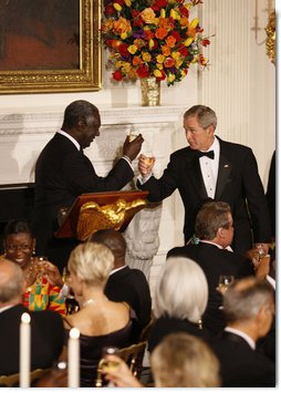 President George W. Bush and President John Agyekum Kufuor of Ghana tip their glasses in a toast during a White House State Dinner Monday, Sept. 15, 2008, in honor of President Kufuor and Mrs. Theresa Kufuor. White House photo by Eric Draper