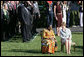 Mrs. Laura Bush and Ghana's first lady Theresa Kufuor sit together on the South Lawn of the White House during the South Lawn Arrival Ceremony Monday, Sept. 15, 2008, on the South Lawn of the White House. White House photo by Chris Greenberg