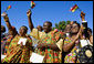 Guests in traditional Ghanaian dress celebrate the arrival of President John Agyekum Kufuor of Ghana to the White House Monday, Sept. 15, 2008, during a South Lawn Arrival Ceremony. White House photo by David Bohrer
