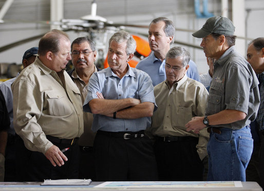 President George W. Bush meets with locals officials at the U.S. Coast Guard facility at Ellington Field in Houston Tuesday, Sept. 16, 2008 before taking an aerial tour of Texas areas damaged in last weekend's hurricane. Said the President afterward, "My first observation is that the state government and local folks are working very closely and working hard and have put a good response together. The evacuation plan was excellent in its planning and in execution. The rescue plan was very bold, and we owe a debt of gratitude to those who were on the front line pulling people out of harm's way, like the Coast Guard people behind us here." White House photo by Eric Draper