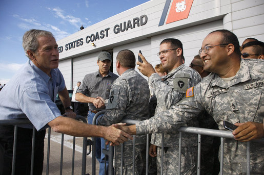 President George W. Bush shakes hands of military personnel outside the emergency operations center at the U.S. Coast Guard Hangar at Ellington Field in Houston Tuesday, Sept. 16, 2008, during his visit to Texas to see firsthand the destruction left in the wake of last weekend's Hurricane Ike. White House photo by Eric Draper