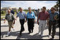 President George W. Bush walks hand-in-hand with Galveston Mayor Lyda Ann Thomas Tuesday, Sept. 16, 2008, during a visit to the Texas area hard hit by last weekend's Hurricane Ike. Walking with them from left are: Charlie Kelly, Emergency Manager Coordinator for the City of Galveston; President Bush, Mayor Thomas, Steve LeBlanc, Galveston City Manager and Texas Congressman Nick Lampson. White House photo by Eric Draper