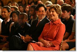 Mrs. Laura Bush and Joe Torsella, President of the National Constitution Center, listen to performance for school children noting the 221st anniversary of the signing of the United States Constitution on Constitution Day. The program, in the East Room of the White House on Sept. 17, 2008, was designed to help make the children more aware of United States History. Mrs. Bush pointed out that Constitution Day is designed to encourage Americans to learn more about our country's founding documents. The performance was part of the six-year-old We the People program created by President George W. Bush. White House photo by Joyce N. Boghosian
