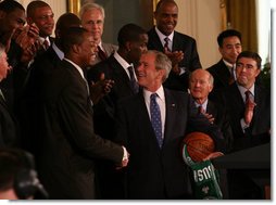 President George W. Bush shakes hands with Paul Pierce, team captain of the Boston Celtics, after Pierce presented him with a signed basketball and jersey Friday, Sept. 19, 2008, on behalf of the 2008 NBA Championship team. Pierce used the occasion of the team's visit to the White House to announce its donation of $100,000 to the American Red Cross to aid those affected by Hurricane Ike. White House photo by Joyce N. Boghosian