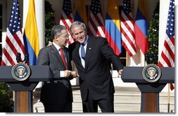 President George W. Bush talks with Colombian President Alvaro Uribe following a joint press availability Saturday, Sept. 20, 2008, in the Rose Garden at the White House.  White House photo by Eric Draper