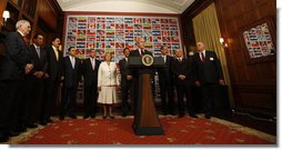 President George W. Bush is surrounded by leaders from the Western Hemisphere as he delivers a statement on free trade Wednesday, Sept. 24, 2008, at the Council of the Americas in New York City. Said the President, "Each of the 11 countries here has a free trade agreement with the United States, or one pending before Congress. Free and fair trade is in our mutual interests."  White House photo by Eric Draper
