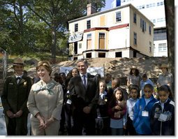 Mrs. Laura Bush stands with children from the Adam Clayton Powell Jr. Elementary School (P.S. 153) and the Boys and Girls Club of Harlem as she addresses media after participating in a First Bloom program at the Hamilton Grange National Memorial in New York City, Sept. 24, 2008. The plantings are part of the restoration efforts at the historic home of Alexander Hamilton. White House photo by Chris Greenberg