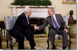 President George W. Bush and President Mahmoud Abbas exchange handshakes Thursday, Sept. 25, 2008, during their visit in the Oval Office of the White House. The leader of the Palestinian Authority thanked President Bush for his efforts to bring peace to the Mideast saying, "Mr. President, I would like to take the opportunity to thank you and thank the United States for the help and the support and the aid that you have given us, and as well as the efforts that you led to mobilize the world to help the Palestinian Authority on the economic front as well as on the security front. Mr. President, we will continue to work with you and we will continue to keep the hope alive in order to reach a political solution for our issue and for the Middle East."  White House photo by Eric Draper