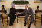 President George W. Bush welcomes Prime Minister Manmohan Singh of India to the Oval Office Thursday, Sept. 25, 2008, prior to their meeting and dinner at the White House. White House photo by Eric Draper