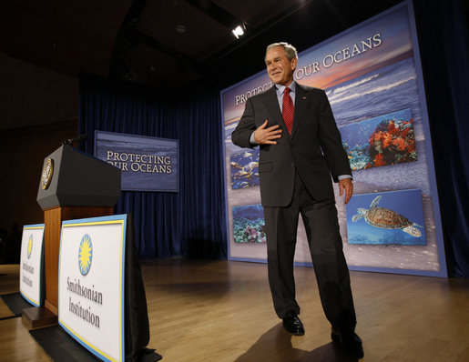 President George W. Bush smiles after delivering his remarks on U.S. Ocean Action Plan Friday, Sept. 26, 2008, at the Smithsonian Museum of Natural History. The U.S. Ocean Action Plan established a coordinated ocean governance structure to enhance leadership and coordination among the Federal agencies with ocean-related responsibilities and activities. White House photo by Eric Draper