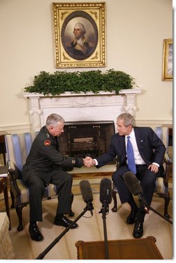 President George W. Bush welcomes General David D. McKiernan, Commander for NATO International Security Assistance Force in Afghanistan, to the Oval Office Wednesday, Oct. 1, 2008. White House photo by Eric Draper