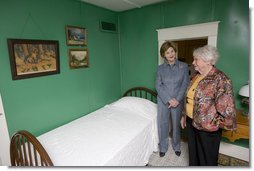 Mrs. Jean Coday, Director and President of the Laura Ingalls Wilder Historic Home and Museum, shows Mrs. Laura Bush the famous author's simple bedroom in Mansfield, Mo., Oct. 3, 2008. The home is where the "Liittle House" book series was written. Mrs. Bush, who is encouraging Americans to read our country's literary classics, noted that Laura Ingalls Wilder is an American author whose books have been loved by children and adults for over 70 years. The First Lady's mother read the books to her as a child before she could read. This week the home was designated a Save America's Treasures project.  White House photo by Chris Greenberg