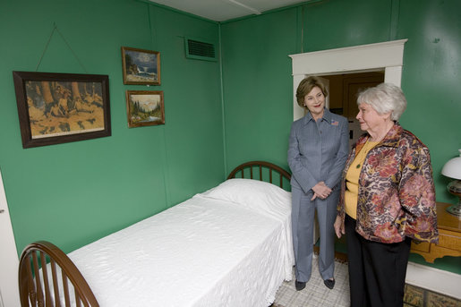Mrs. Jean Coday, Director and President of the Laura Ingalls Wilder Historic Home and Museum, shows Mrs. Laura Bush the famous author's simple bedroom in Mansfield, Mo., Oct. 3, 2008. The home is where the "Liittle House" book series was written. Mrs. Bush, who is encouraging Americans to read our country's literary classics, noted that Laura Ingalls Wilder is an American author whose books have been loved by children and adults for over 70 years. The First Lady's mother read the books to her as a child before she could read. This week the home was designated a Save America's Treasures project. White House photo by Chris Greenberg