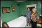 Mrs. Jean Coday, Director and President of the Laura Ingalls Wilder Historic Home and Museum, shows Mrs. Laura Bush the famous author's simple bedroom in Mansfield, Mo., Oct. 3, 2008. The home is where the "Liittle House" book series was written. Mrs. Bush, who is encouraging Americans to read our country's literary classics, noted that Laura Ingalls Wilder is an American author whose books have been loved by children and adults for over 70 years. The First Lady's mother read the books to her as a child before she could read. This week the home was designated a Save America's Treasures project. White House photo by Chris Greenberg
