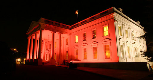 The north side of the the White House turned pink on the evening of Oct. 7, 2008 to raise awareness about breast cancer. The unique view of the North Portico and the side of the house facing Lafayette Park was in observance of Breast Cancer Awareness Month. Breast cancer awareness is a cause Mrs. Laura Bush has worked on around the world. The World Health Organization estimates that each year more than 1.2 million people worldwide are diagnosed with it and breast cancer is one of the leading causes of death for women. White House photo by Grant Miller