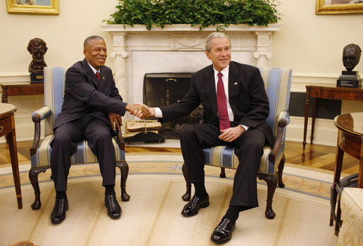 President George W. Bush welcomes Prime Minister Tillman Thomas of Grenada to the Oval Office Wednesday, Oct. 8, 2008, at the White House. White House photo by Eric Draper