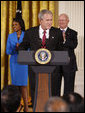 President George W. Bush welcomes guests to the East Room of the White House prior to signing H.R. 7081, The United States-India Nuclear Cooperation Approval and Nonproliferation Enhancement Act, Wednesday, Oct. 8, 2008, in the East Room at the White House. White House photo by Eric Draper