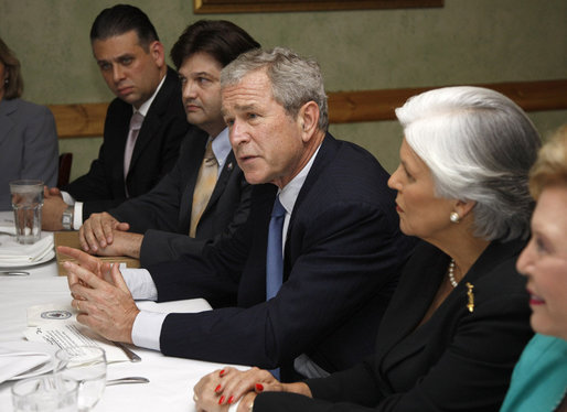 President George W. Bush speaks with reporters at the conclusion of his meeting with Cuban American community leaders Friday, Oct. 10, 2008, at Havana Harry's restaurant in Coral Gables, Fla. President Bush is flanked by Javier de Cespedes, president of Directorio Democratico and Sylvia Iriondo, right, president of Mothers and Women Against Repression (M.A.R.) Por Cuba. White House photo by Eric Draper