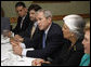 President George W. Bush speaks with reporters at the conclusion of his meeting with Cuban American community leaders Friday, Oct. 10, 2008, at Havana Harry's restaurant in Coral Gables, Fla. President Bush is flanked by Javier de Cespedes, president of Directorio Democratico and Sylvia Iriondo, right, president of Mothers and Women Against Repression (M.A.R.) Por Cuba. White House photo by Eric Draper